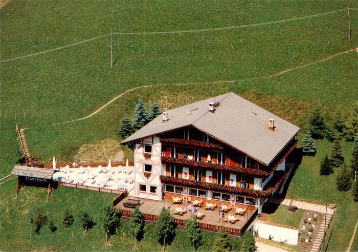 Sexten Sesto Suedtirol IT Gaestehaus Gruber mit Terrassencafe Fliegeraufnahme