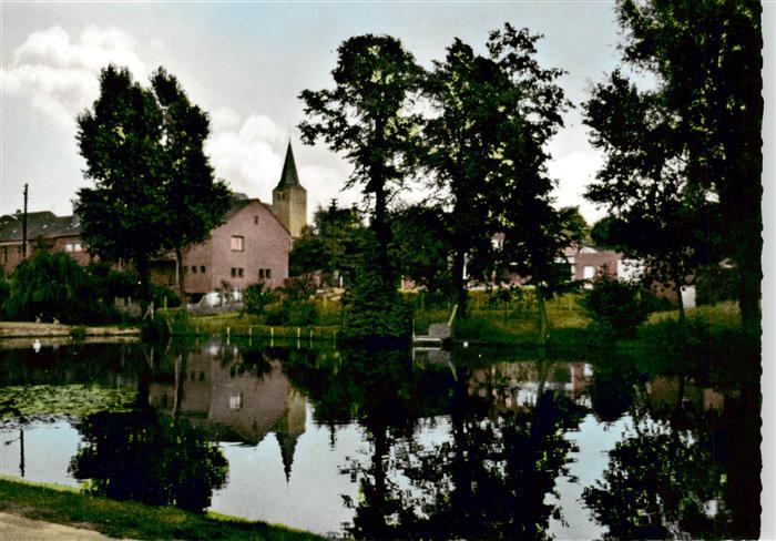 Niederkruechten Dorfweiher mit Kirche
