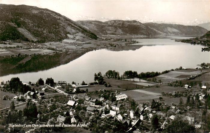 Steindorf Ossiacher See Kaernten AT Fliegeraufnahme mit Julische Alpen