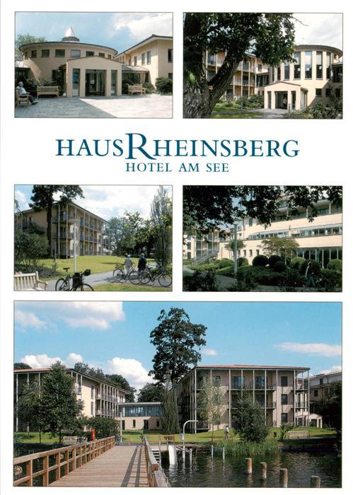 Rheinsberg Brandenburg Haus-Rheinsberg Hotel-am-See Hotelgebaeude Park See Steg