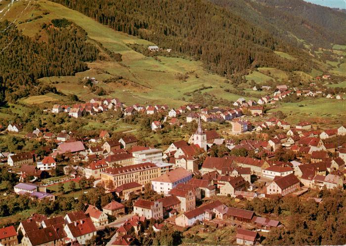 Fohnsdorf Steiermark AT Stadtmitte Kirche Daecher Wald Huegel Wiesen Wohnhaeuser