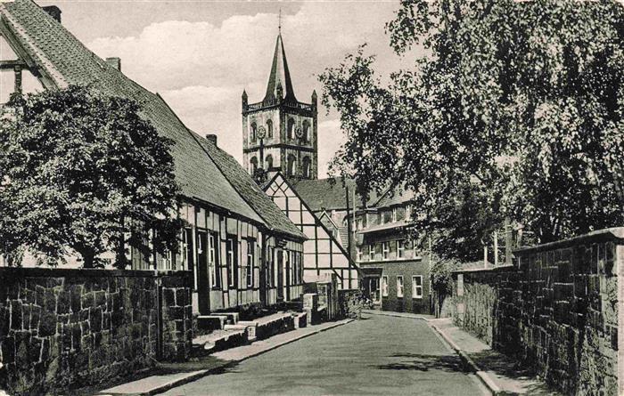 Ibbenbueren NRW Klosterstrasse Kirchturm Fachwerkhaus Stadtmauer Strasse Baeume